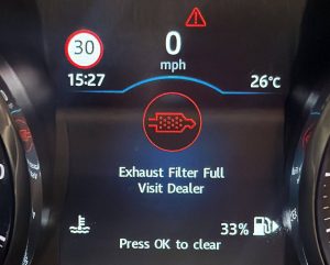 Dashboard displaying an Exhaust Filter Full warning on a diesel vehicle